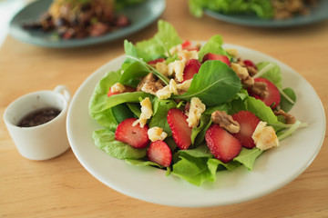 salad with strawberry spinach leaves and feta cheese