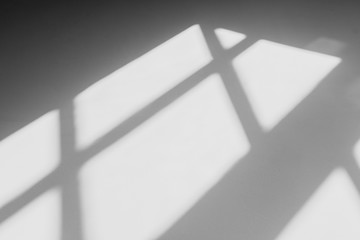 abstract shadow of the window in morning light on white wall texture background