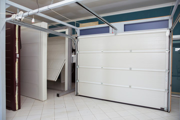 Shutter door or roller door and concrete floor outside .White Automatic shutters in a house . gates...