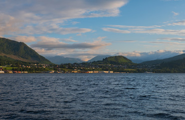 Orsta Norway. Evening cityscape and fjord landscape in july 2019