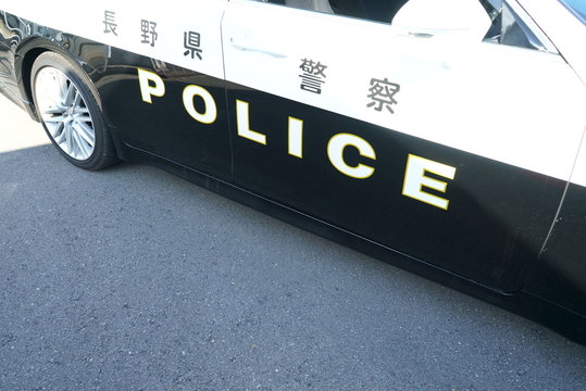 Bokeh image of Japanese police car