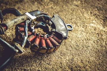 Ignition of electronic motorcycles or scooters Magnetic coils or CDI units with a white background