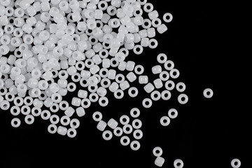 White pearls on the black background. Composition of different shaped natural fresh water pearls.