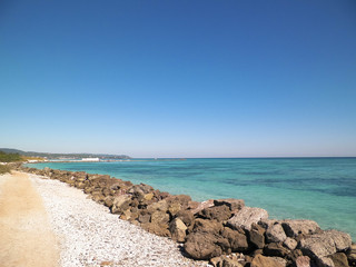 Fototapeta na wymiar Breakwater on beach in Vada, Italy.