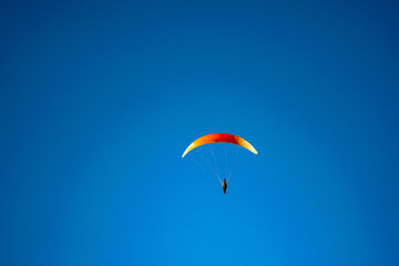 Paragliding in a blue sky