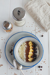 Semolina porridge with apples and currants for breakfast on a white background