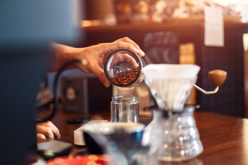 remove the beans from the bottle with a measure spoon