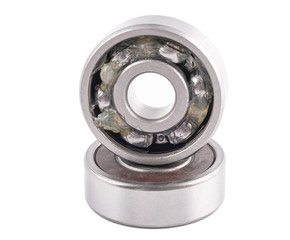 Closed up macro : Ball bearing which contained lithium grease (NLGI 3) place on the other ball bearing isolated on white background. Industrial concept