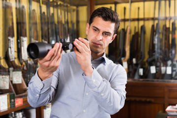 Adult man looking for optical sights