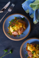Twice Baked Potatoes with Bacon, Cheese and  Scallion. Potato in jacket. Overhead vertical image