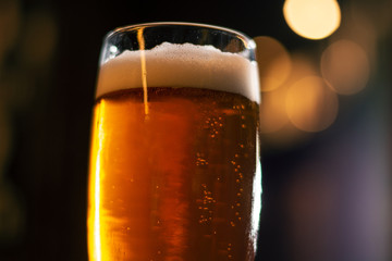 golden craft beer on blurred background