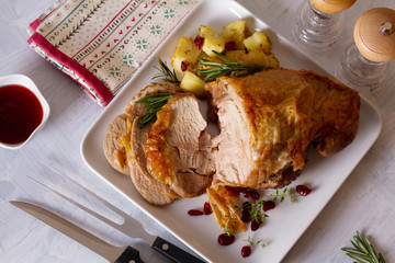 Roast turkey leg. Boned and rolled turkey leg with potatoes and cranberries. View from above, top...