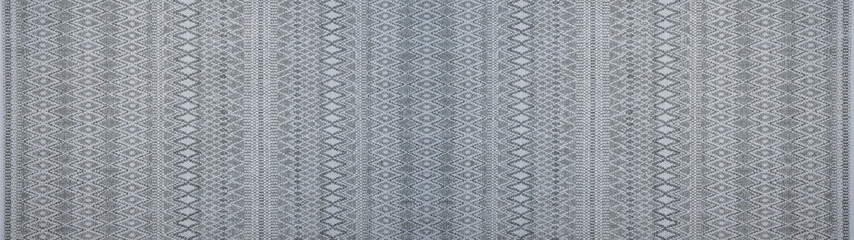 Geometric gray woven cotton textile with diamond rhombus pattern texture background banner panorama