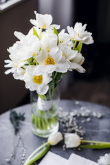 Naklejka na ściany i meble Bouquet of white tulips in vase. International Women's Day. spring flowers