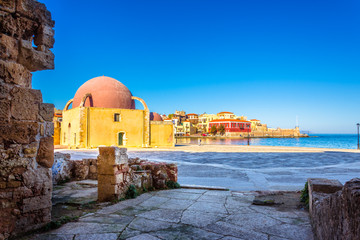 The beautiful old harbor of Chania with the amazing mosque, venetian shipyards, Crete, Greece.