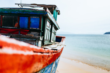 Old fishing boat, rust on the hull. A traditional Asian fishing boat. Travel in Vietnam