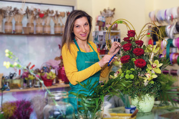 Female florist creating order 