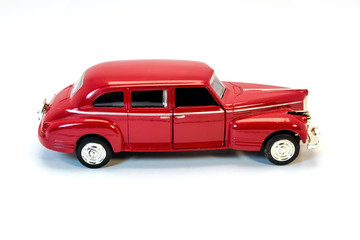 Obraz na płótnie Canvas Children's toy car of red color. Children's toy car isolated on white background.