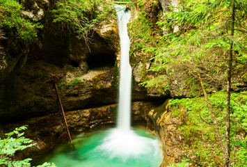 Waterfall in the forest in the Adamello Brenta natural park