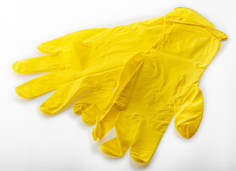 yellow rubber gloves for cleaning isolated on white