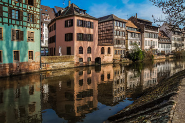 Obraz premium Medieval traditional half-timbered houses in the Petite France district. Pastel colors of early spring. Strasbourg, Alsace, France.