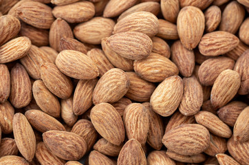 Fototapeta premium Brown almond nuts background texture.