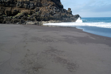 Beach with black volcanic sand on Tenerife island