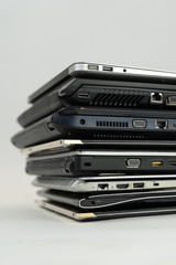 Stack of laptops on top of eachother.