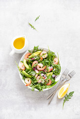 Shrimps avocado and arugula salad, ready to eat healthy and nutritious recipe, overhead view