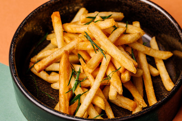 plate with french fries on color background. menu concept