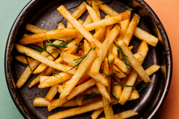 plate with french fries on color background. menu concept