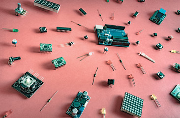Micro electronics arduino DIY components on a light background, top view