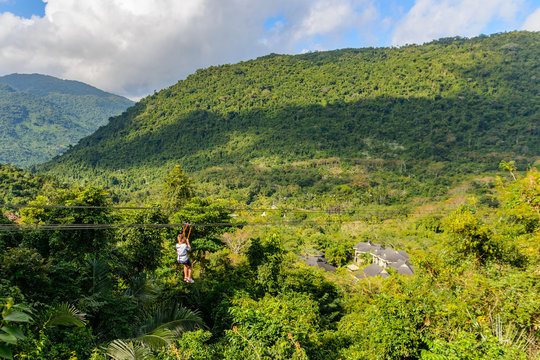 Descent To Zipline Through Mountains, Tropical Forest In Yanoda Park,  Sanya City. Hainan, China.