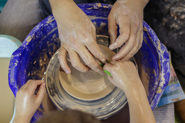 Child made plate on pottery wheel