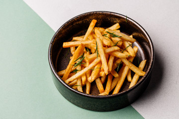 plate with fried potato on color background. menu concept