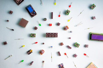 Micro electronics arduino DIY components on a light background, top view