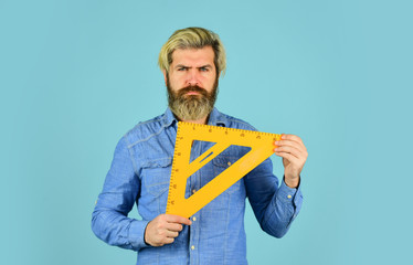 Education. man teacher use triangle tool. bearded tutor man with ruler. draw and measure. back to...