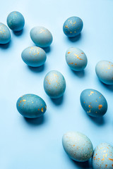 Easter background of eggs painted in blue color. Top view.