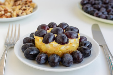 The legendary Tiffany layered salad with grapes, chicken and cheese on the white background.