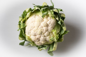 Raw cauliflower on a table ready to be cleaned and cooked. Tasty vegetables