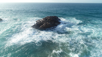 Relax contemplating the breaking of the waves and the mountainous horizon