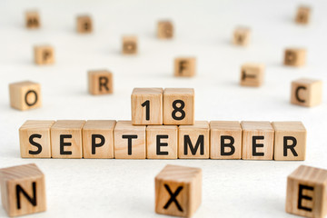 September 18 - from wooden blocks with letters, important date concept, white background random...