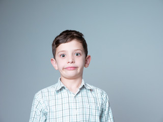 7 year old boy doing funny faces