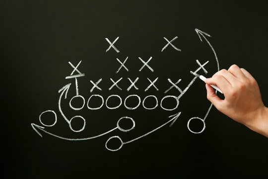 Coach Drawing American Football Playbook Tactics