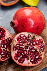 Pomegranate Tropical Fruit Cut in Half on Wooden Board