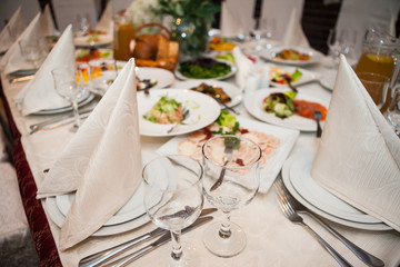 Served for banquet restaurant table with dishes, snack, wine glasses