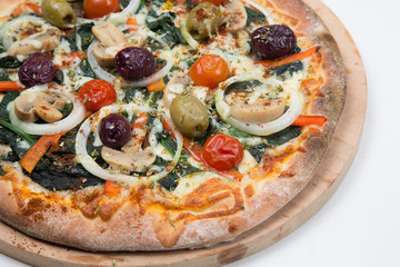 Vegetarian pizza or pizza with onions, mixed olives, mushrooms  and tomato with a white background