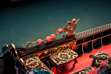 gondola interior of red and gold on a venice canal © C A Creative