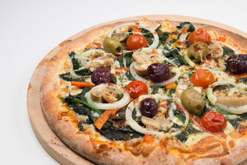 Vegetarian pizza or pizza with onions, mixed olives, mushrooms  and tomato with a white background