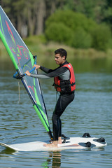 a man is doing windsurf